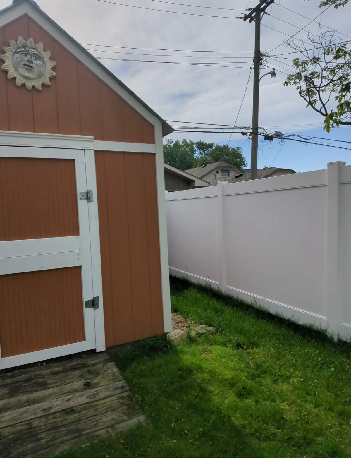 After: new white vinyl privacy fence