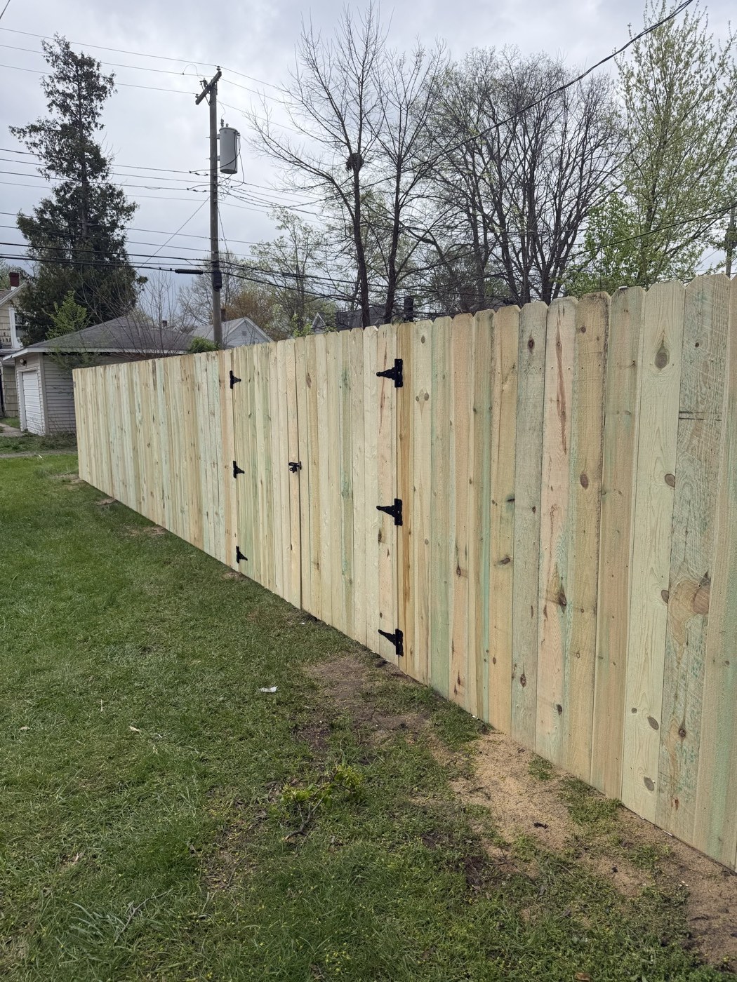 Cedar wood privacy fence with gate, Northern Indiana residential installation