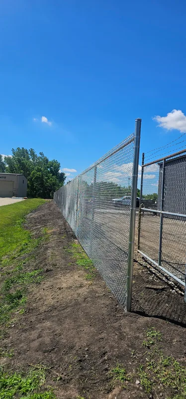 Galvanized chain link fence post detail, commercial installation Northern Indiana