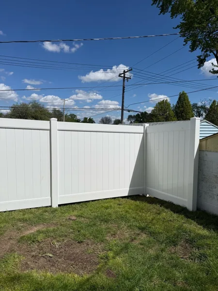 White vinyl privacy fence residential backyard installation, Northern Indiana